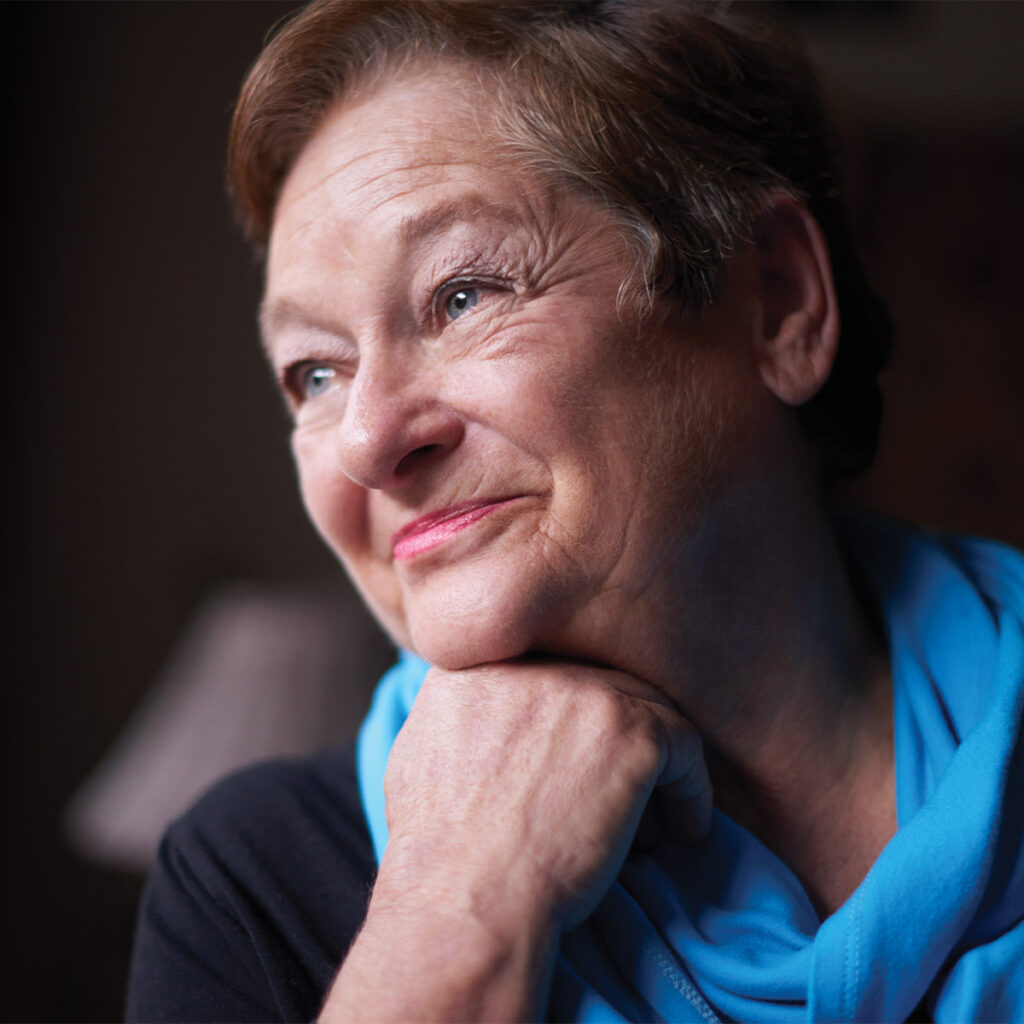 smiling older woman with visible veins