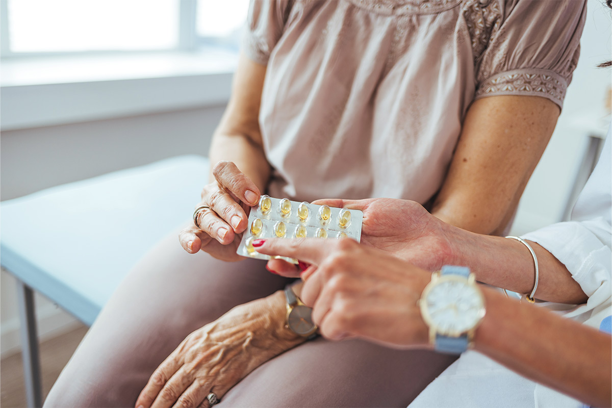 caregiver administering medicine