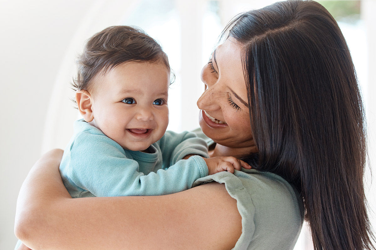 Mom smiling at baby