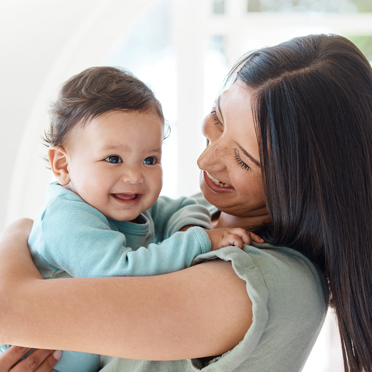 Mom smiling at baby