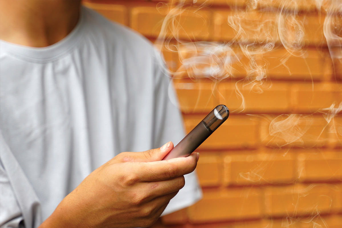 man holding vape pen