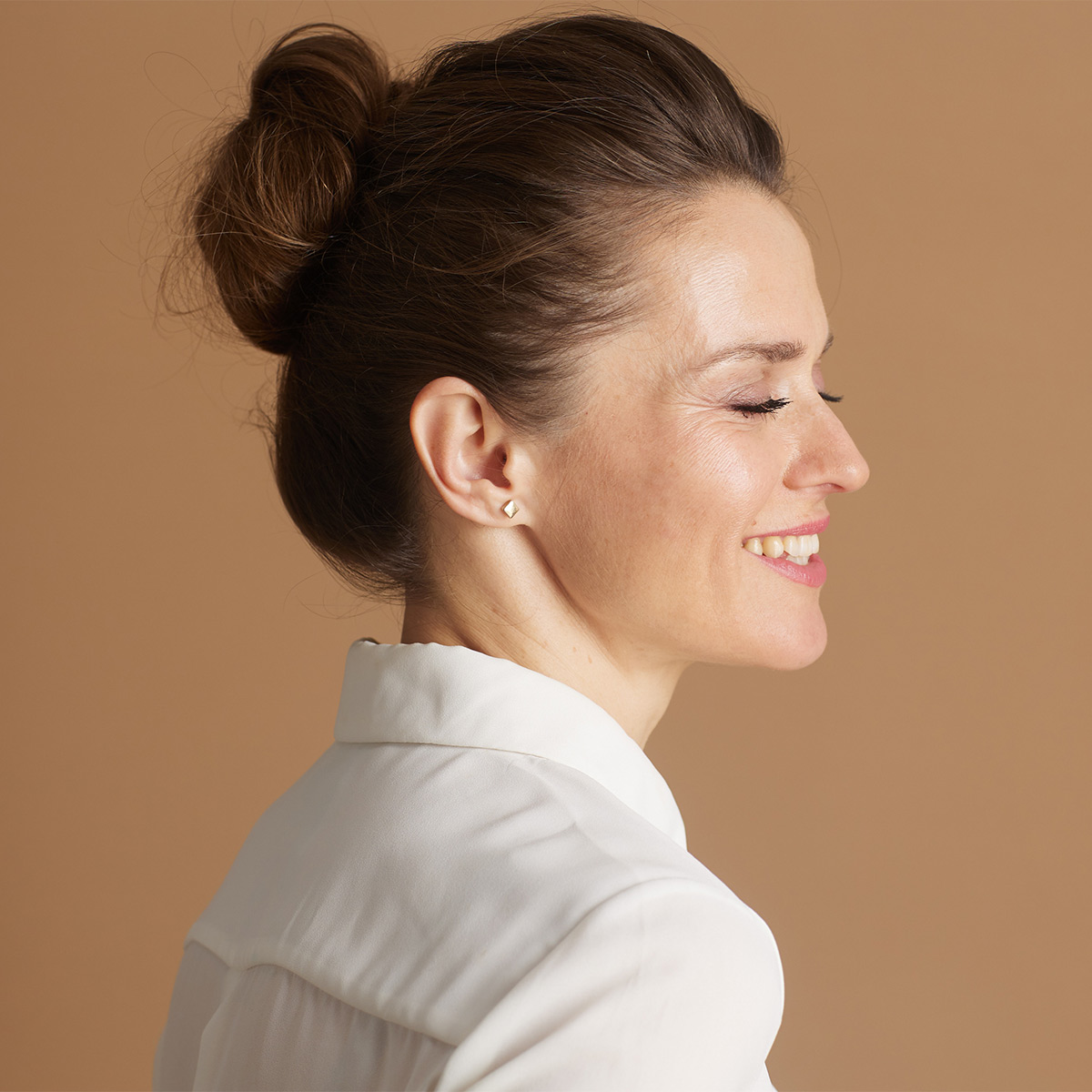 professional woman with hair in bun