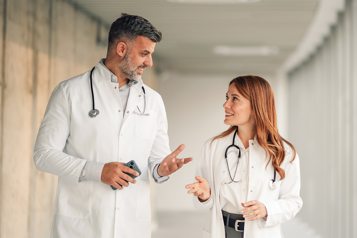 Older doctor mentoring younger doctor