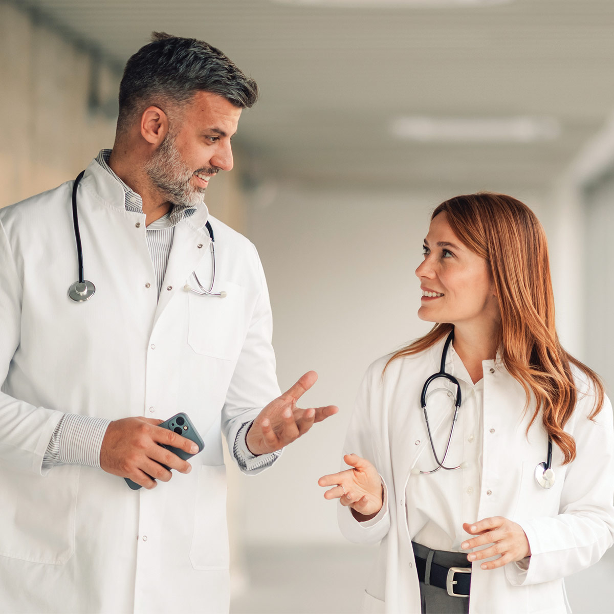 Older doctor mentoring younger doctor