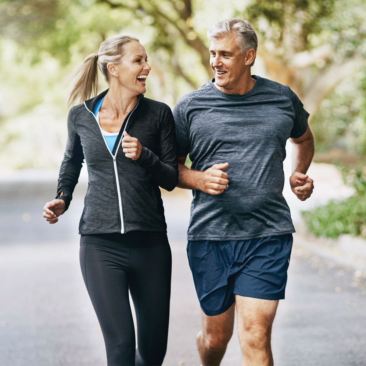 healthy mature couple jogging
