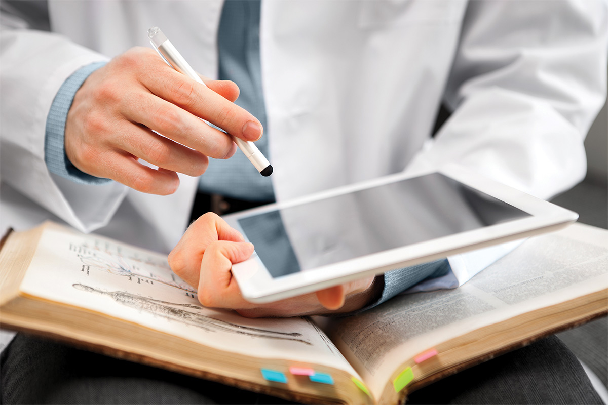 Doctor reading on an ipad
