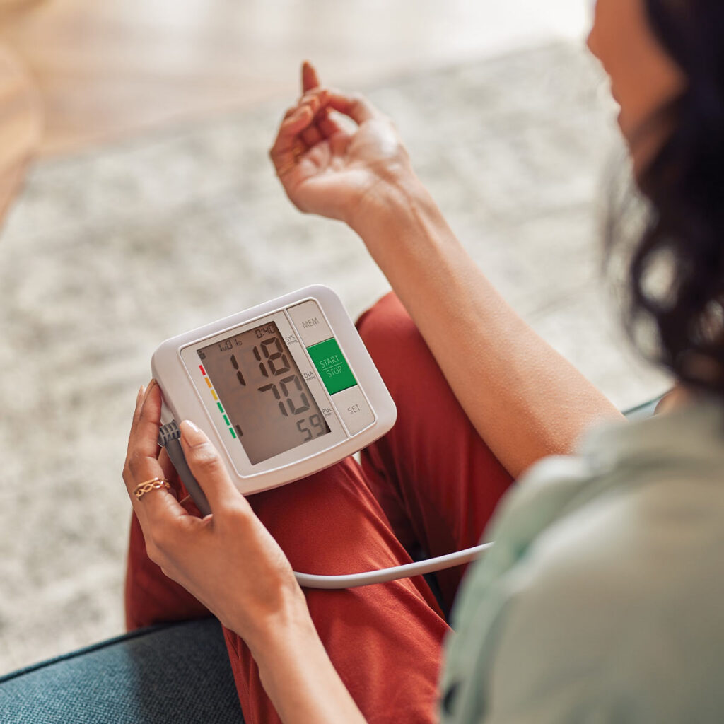 woman checking her blood pressure