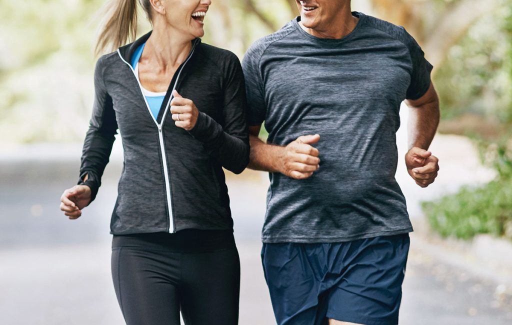 healthy mature couple jogging